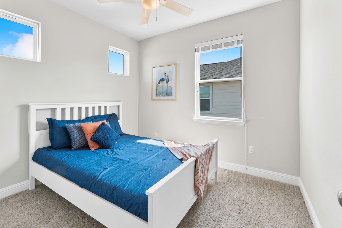 5000 Mandevilla Drive Austin, TX 78739 - Photo 32 of 40 a living room with furniture and a window