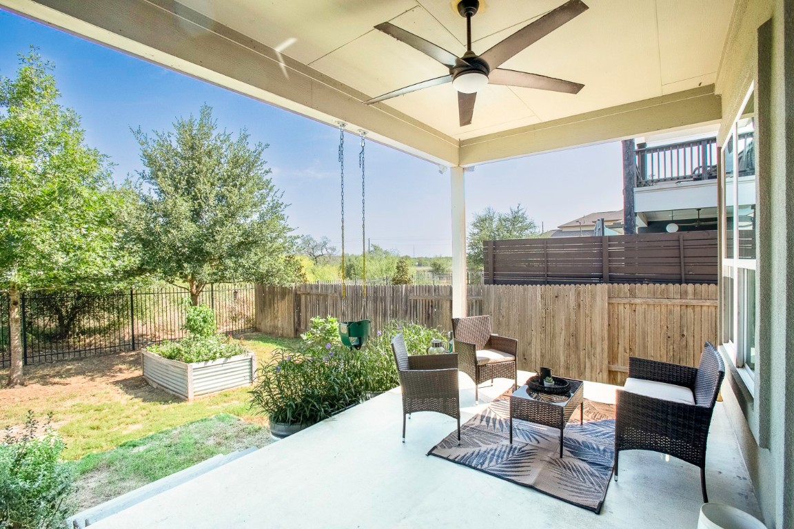 5000 Mandevilla Drive Austin, TX 78739 - Photo 36 of 40 a view of a patio with a table and chairs and a potted plants