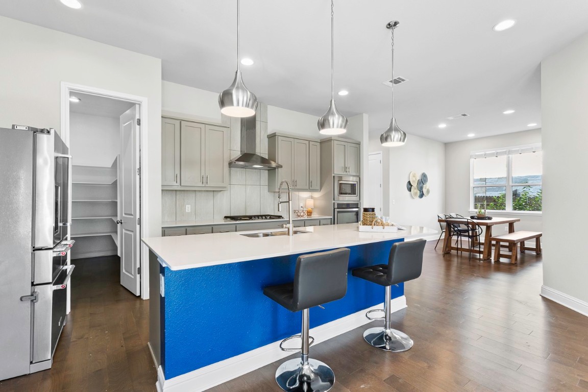 5000 Mandevilla Drive Austin, TX 78739 - Photo 10 of 40 a large kitchen with a table and chairs