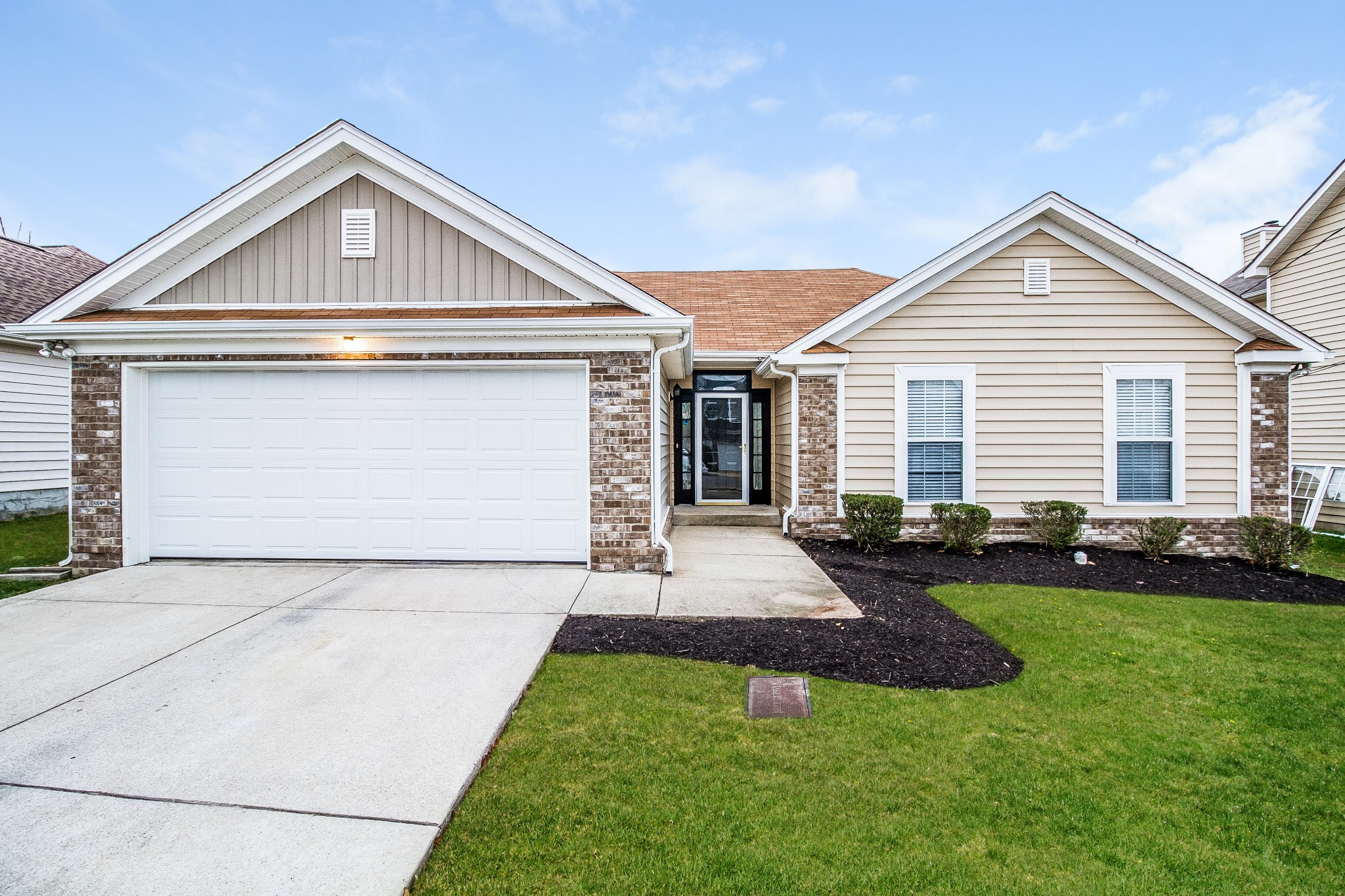 a front view of a house with yard