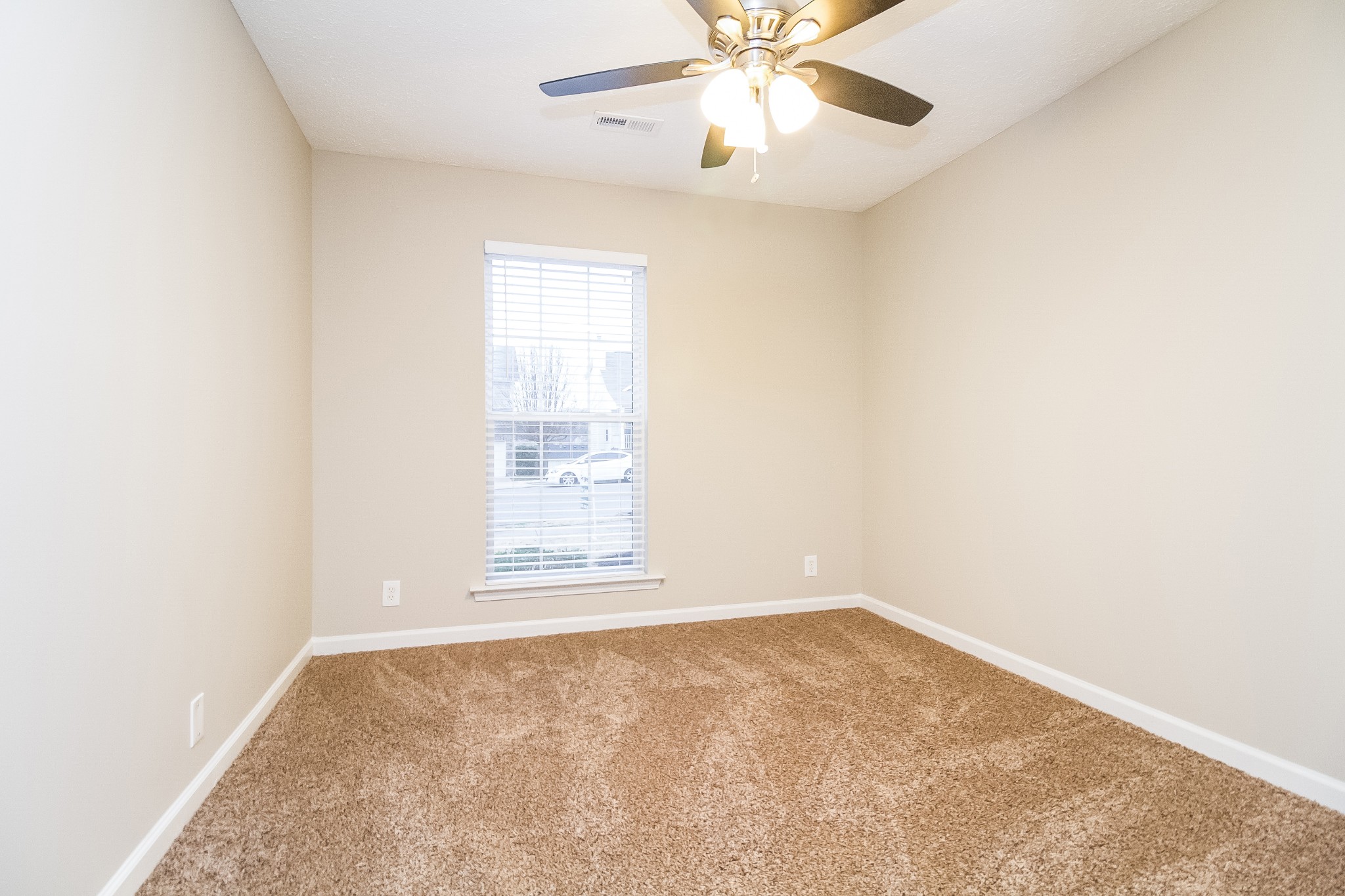 Undisclosed Address Antioch, TN 37013 - Photo 13 of 17 an empty room with a window and a fan