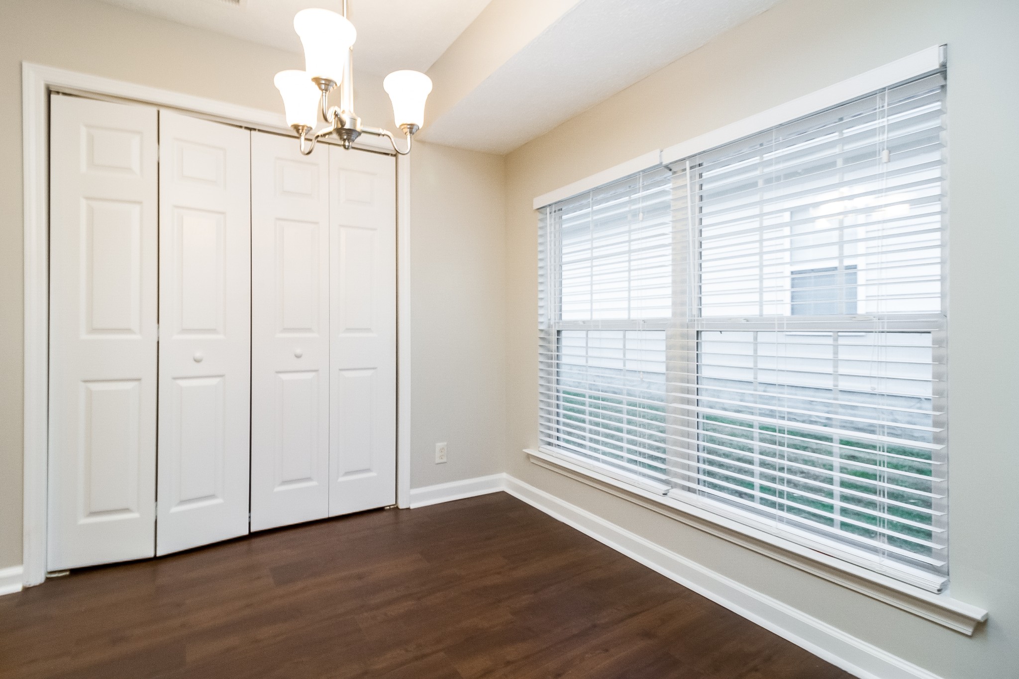 Undisclosed Address Antioch, TN 37013 - Photo 6 of 17 wooden floor in an empty room with a window
