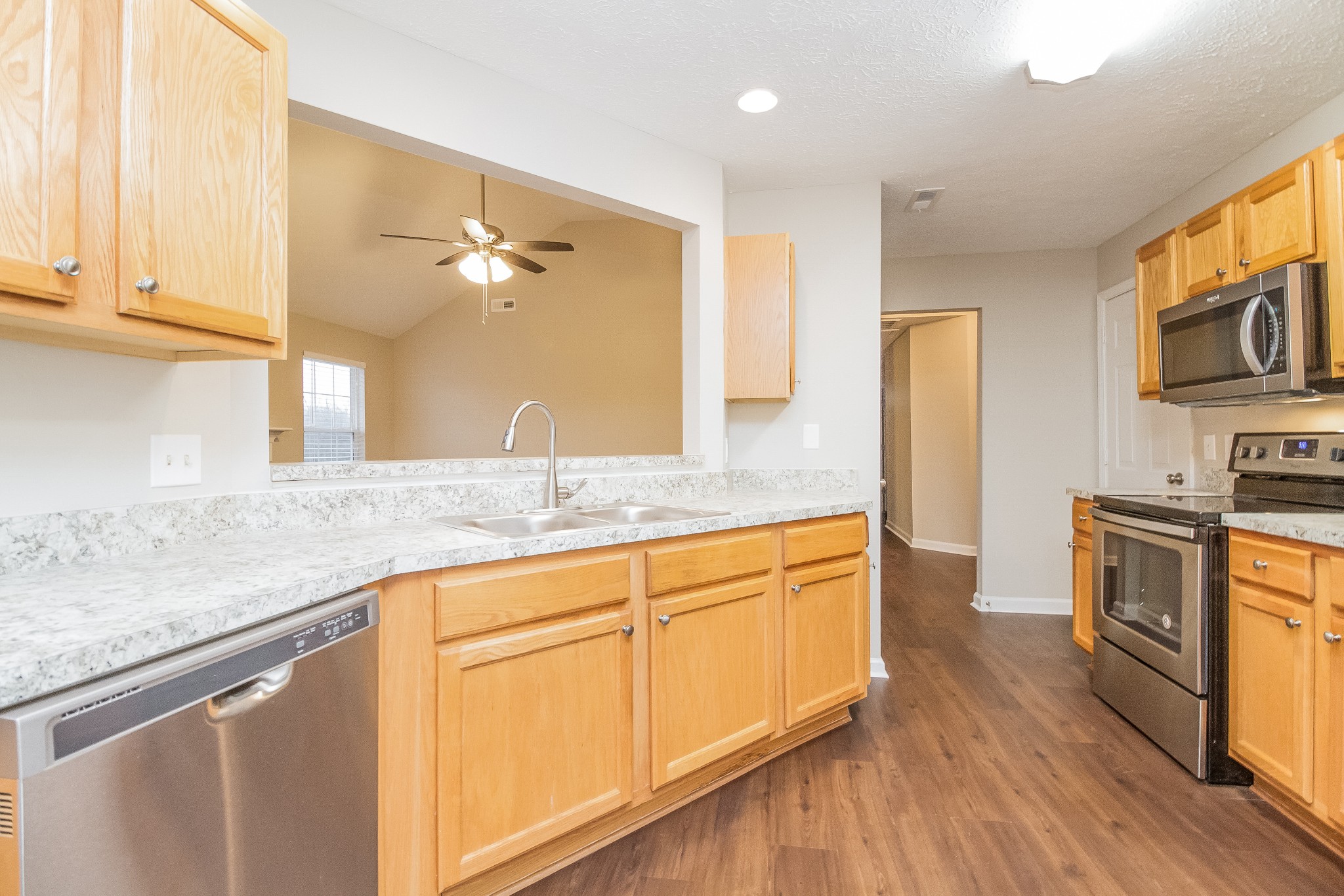 Undisclosed Address Antioch, TN 37013 - Photo 7 of 17 a kitchen with granite countertop white cabinets and stainless steel appliances