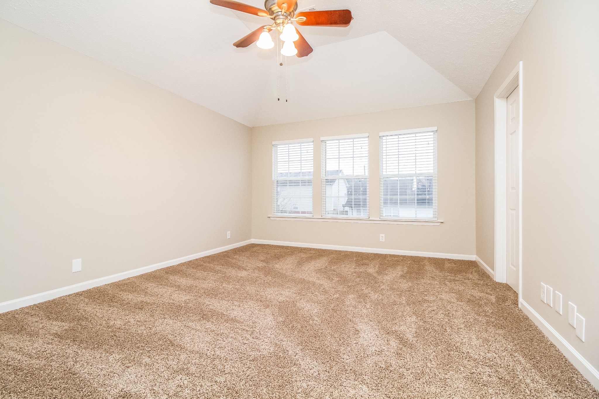 Undisclosed Address Antioch, TN 37013 - Photo 8 of 17 an empty room with chandelier fan and windows
