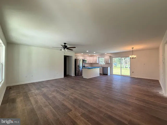 a view of a kitchen with a sink and a window