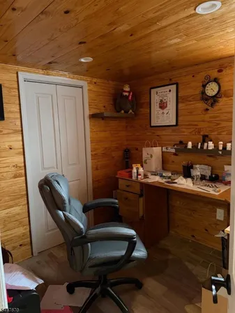 a room with a chair and wooden floor