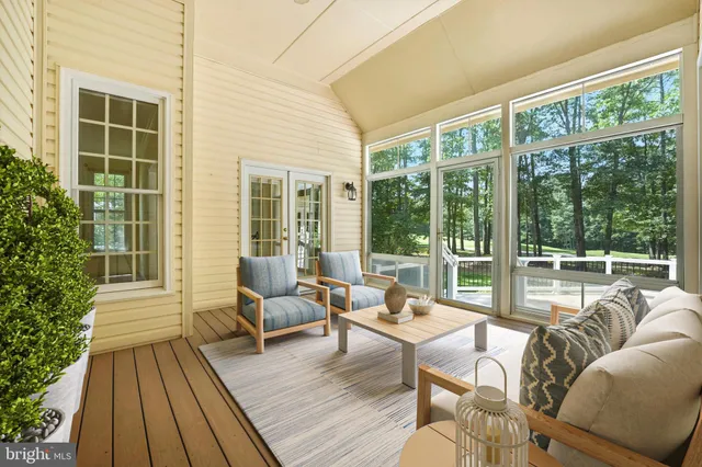 an aerial view of a houses with a yard