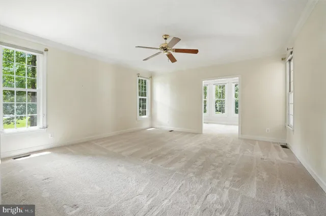 an aerial view of a residential houses with outdoor space and swimming pool