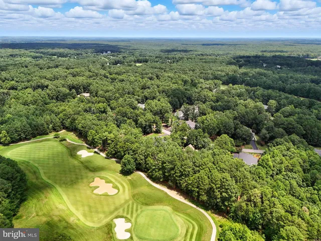a view of swimming pool with outdoor seating and plants