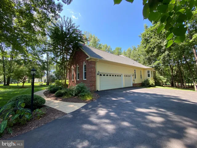 a view of a patio with table and chairs potted plants with wooden floor