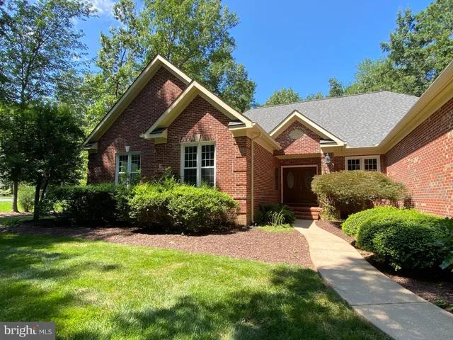 a view of a dining area with furniture and chandelier