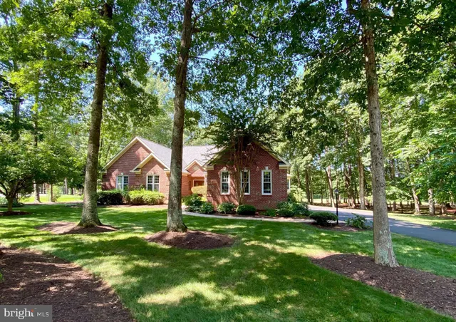 a view of a lake with a house in the background