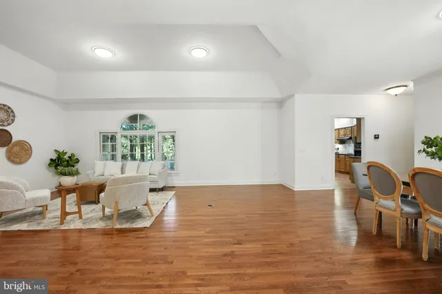 a large kitchen with stainless steel appliances granite countertop a stove and a sink