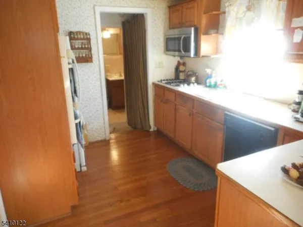 a kitchen with stainless steel appliances a refrigerator and a sink