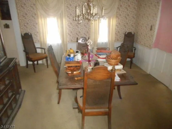a dining room with furniture and window