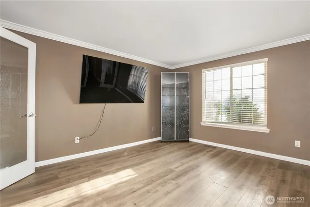 a bathroom with a granite countertop sink a toilet and a mirror