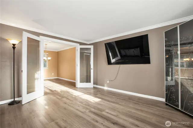 a view of a livingroom with a ceiling fan and window