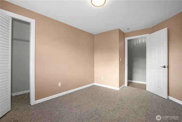 a front view of a house with a garden and plants