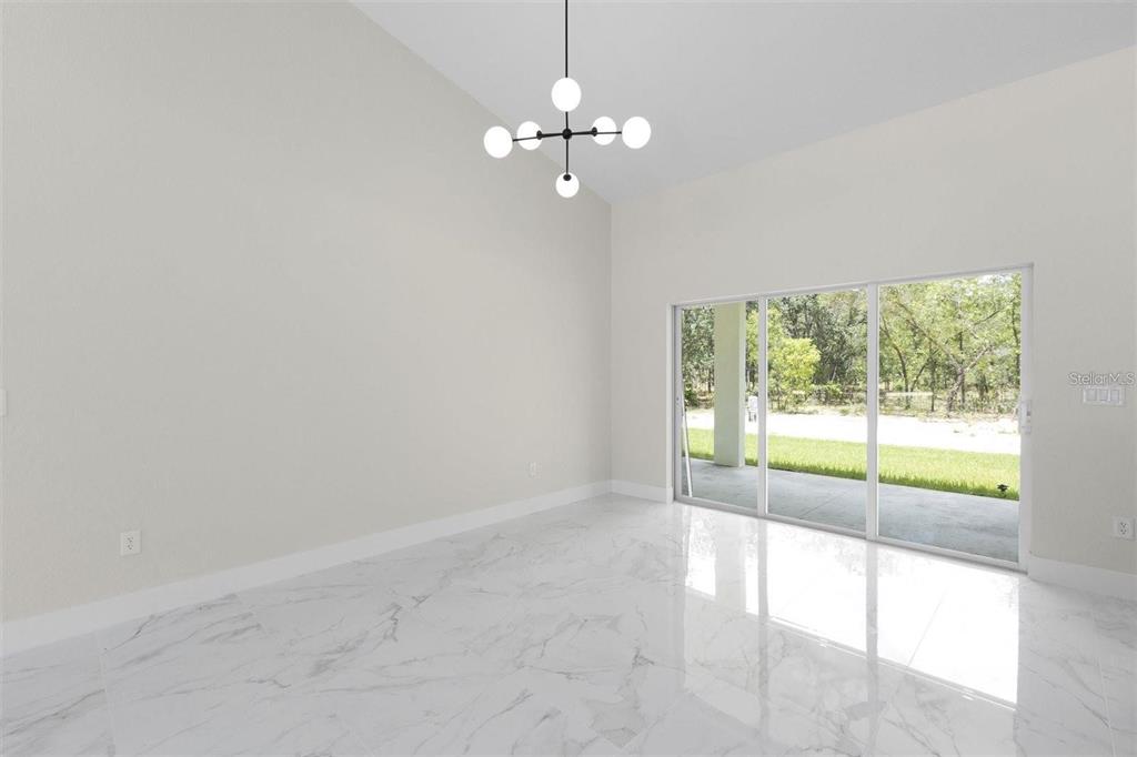 13619 Southwest 78th Place Dunnellon, FL 34432 - Photo 13 of 31 a view of a livingroom with a large window