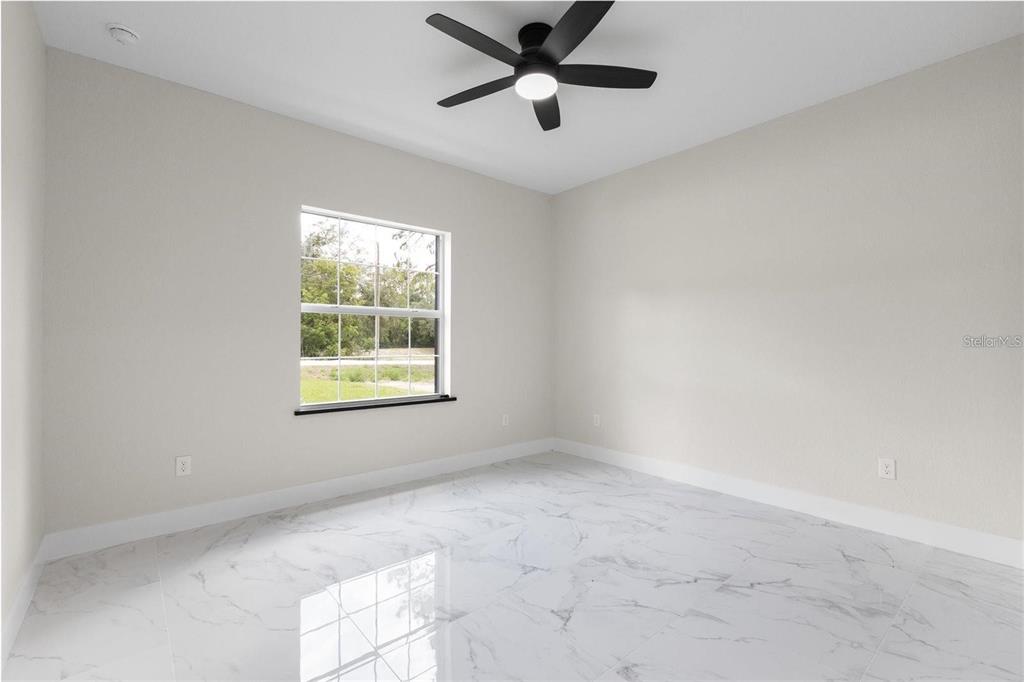 13619 Southwest 78th Place Dunnellon, FL 34432 - Photo 21 of 31 a view of an empty room with a window