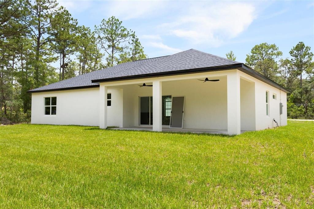 13619 Southwest 78th Place Dunnellon, FL 34432 - Photo 27 of 31 a view of a house with backyard and garden