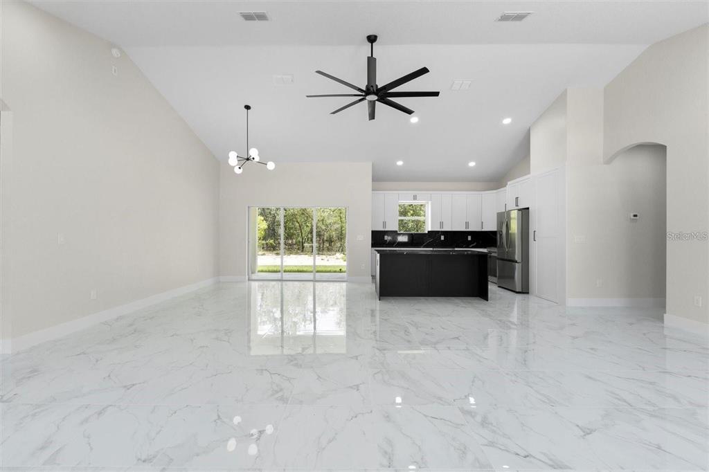13619 Southwest 78th Place Dunnellon, FL 34432 - Photo 5 of 31 a view of a kitchen with a sink and cabinet area
