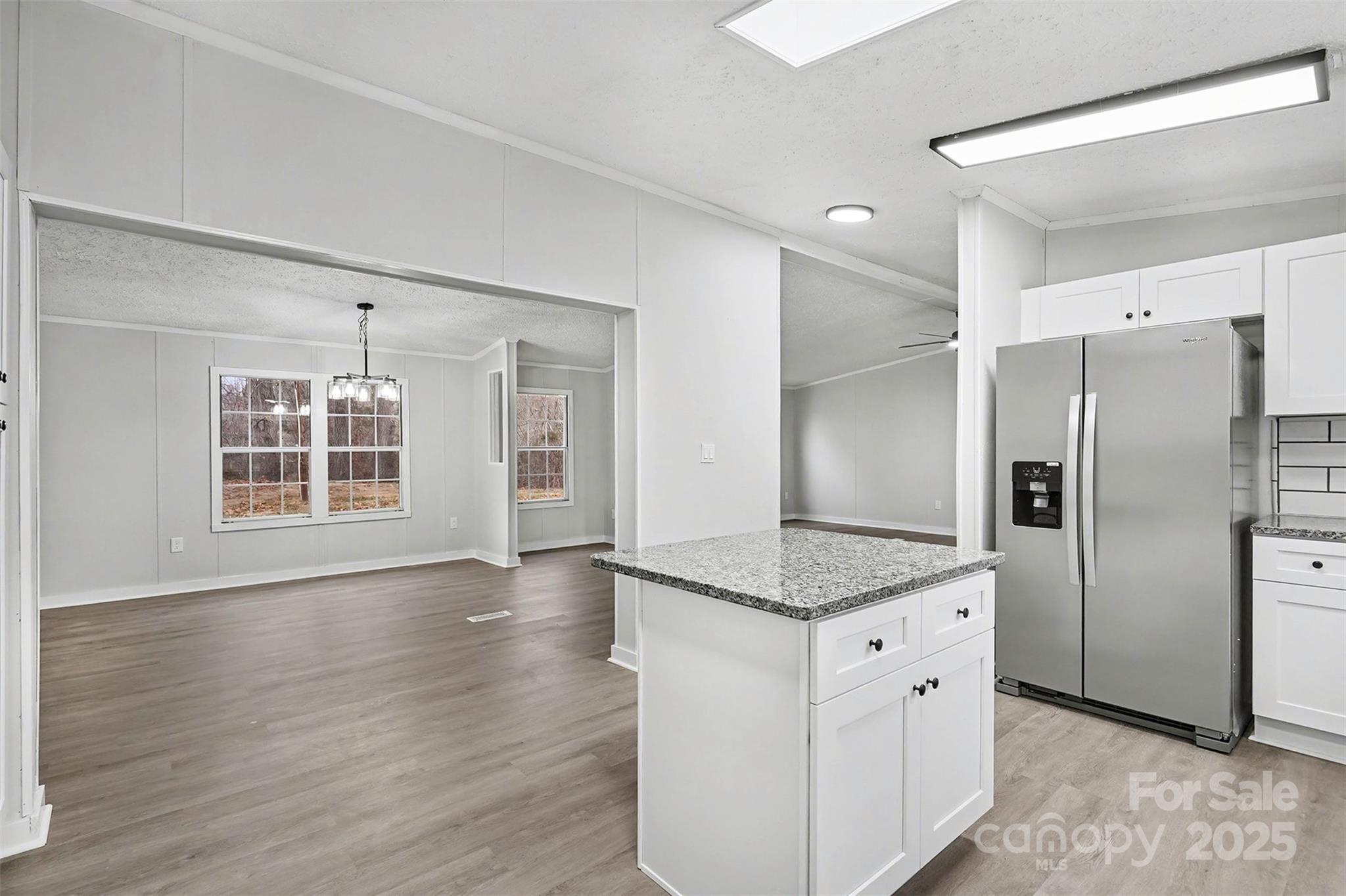 115 Lakeview Lane China Grove, NC 28023 - Photo 13 of 32 a kitchen with stainless steel appliances granite countertop a refrigerator and a sink