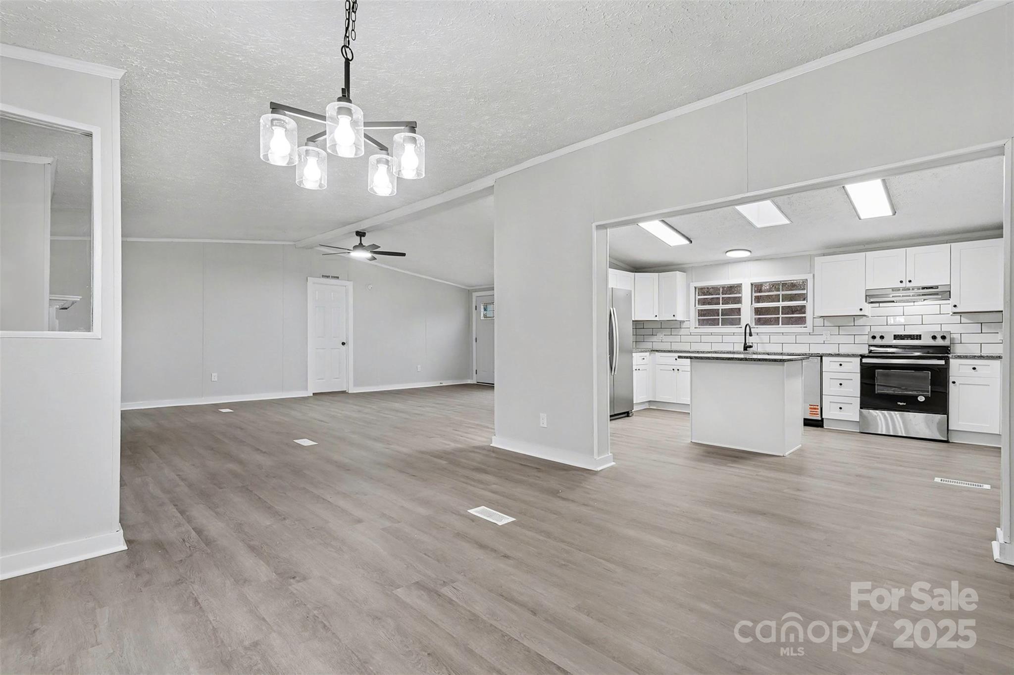 115 Lakeview Lane China Grove, NC 28023 - Photo 15 of 32 a view of a kitchen with a stove cabinets and wooden floor
