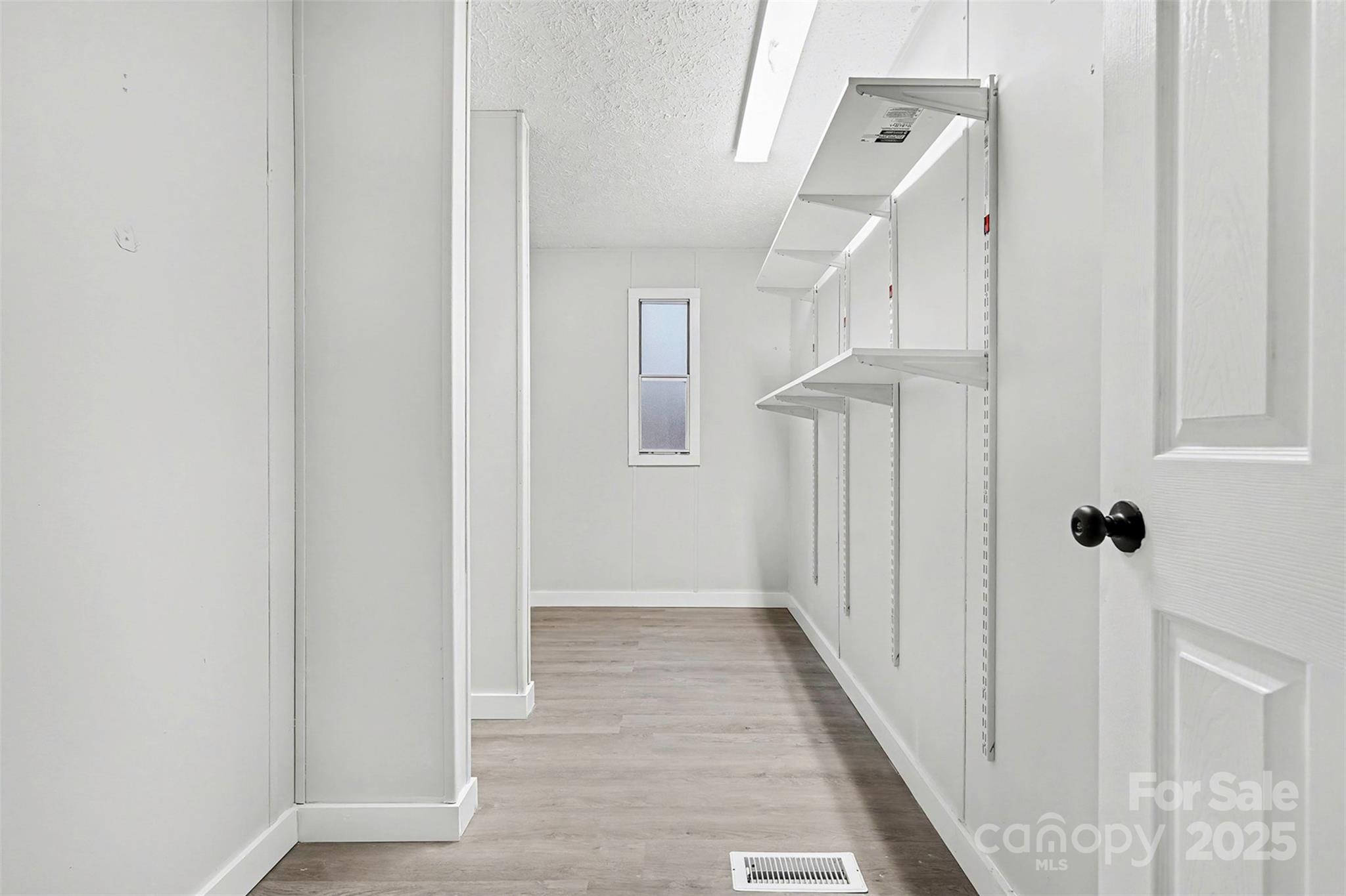 115 Lakeview Lane China Grove, NC 28023 - Photo 18 of 32 a view of a hallway with wooden floor and entryway