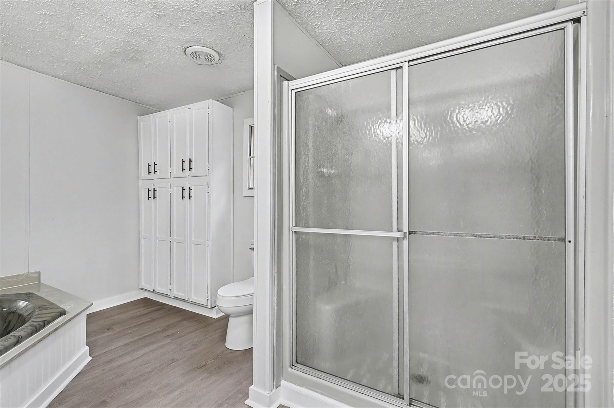 115 Lakeview Lane China Grove, NC 28023 - Photo 20 of 32 a bathroom with a glass shower door