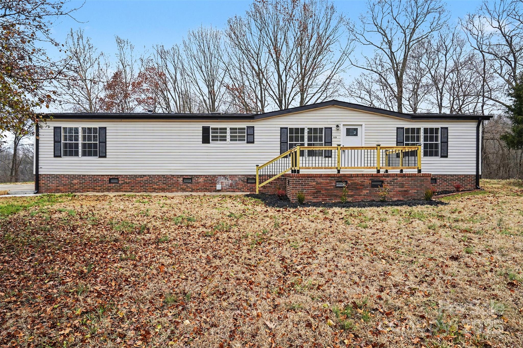 115 Lakeview Lane China Grove, NC 28023 - Photo 2 of 32 a front view of a house with a yard