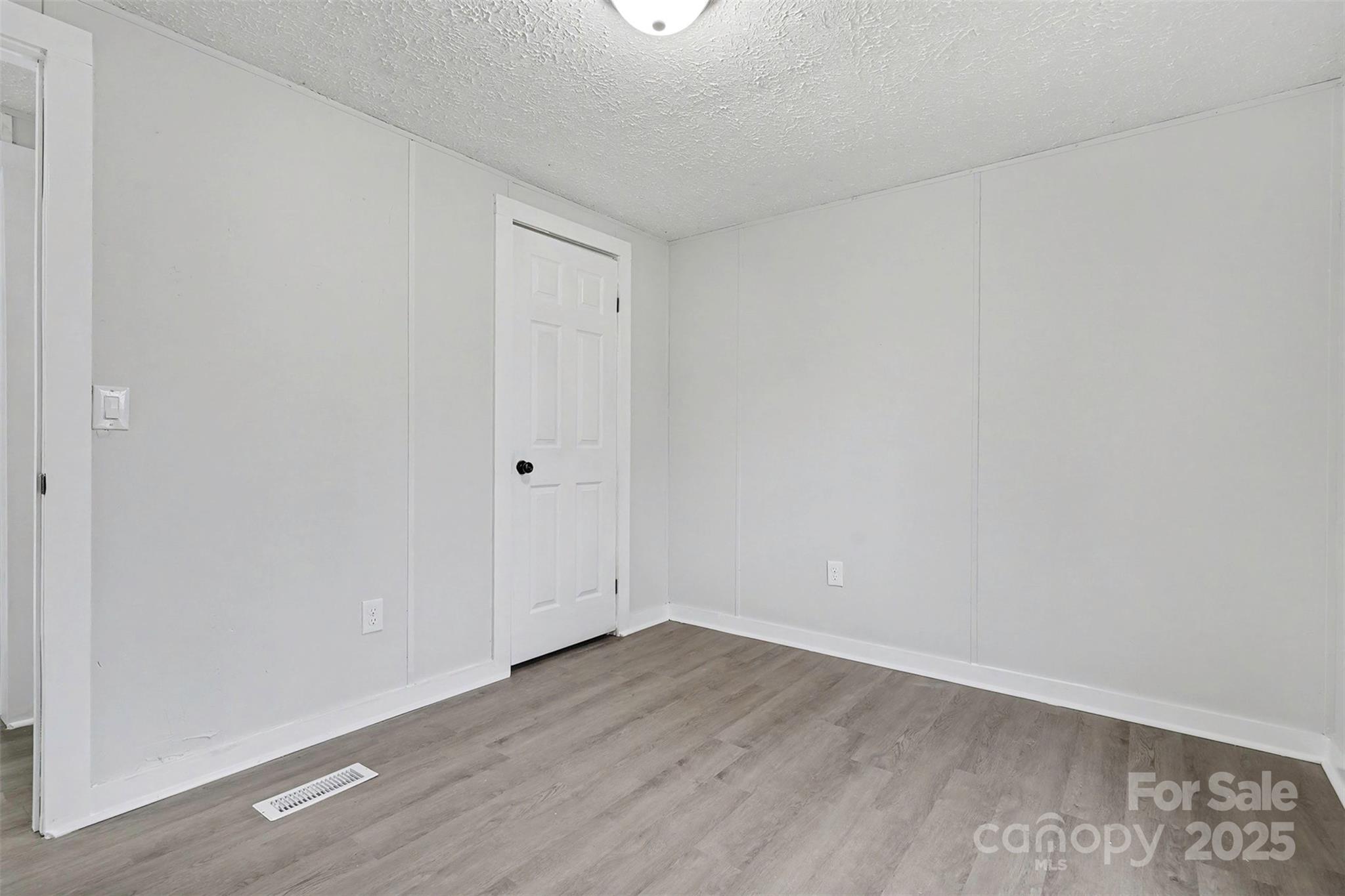 115 Lakeview Lane China Grove, NC 28023 - Photo 24 of 32 a view of an empty room with wooden floor