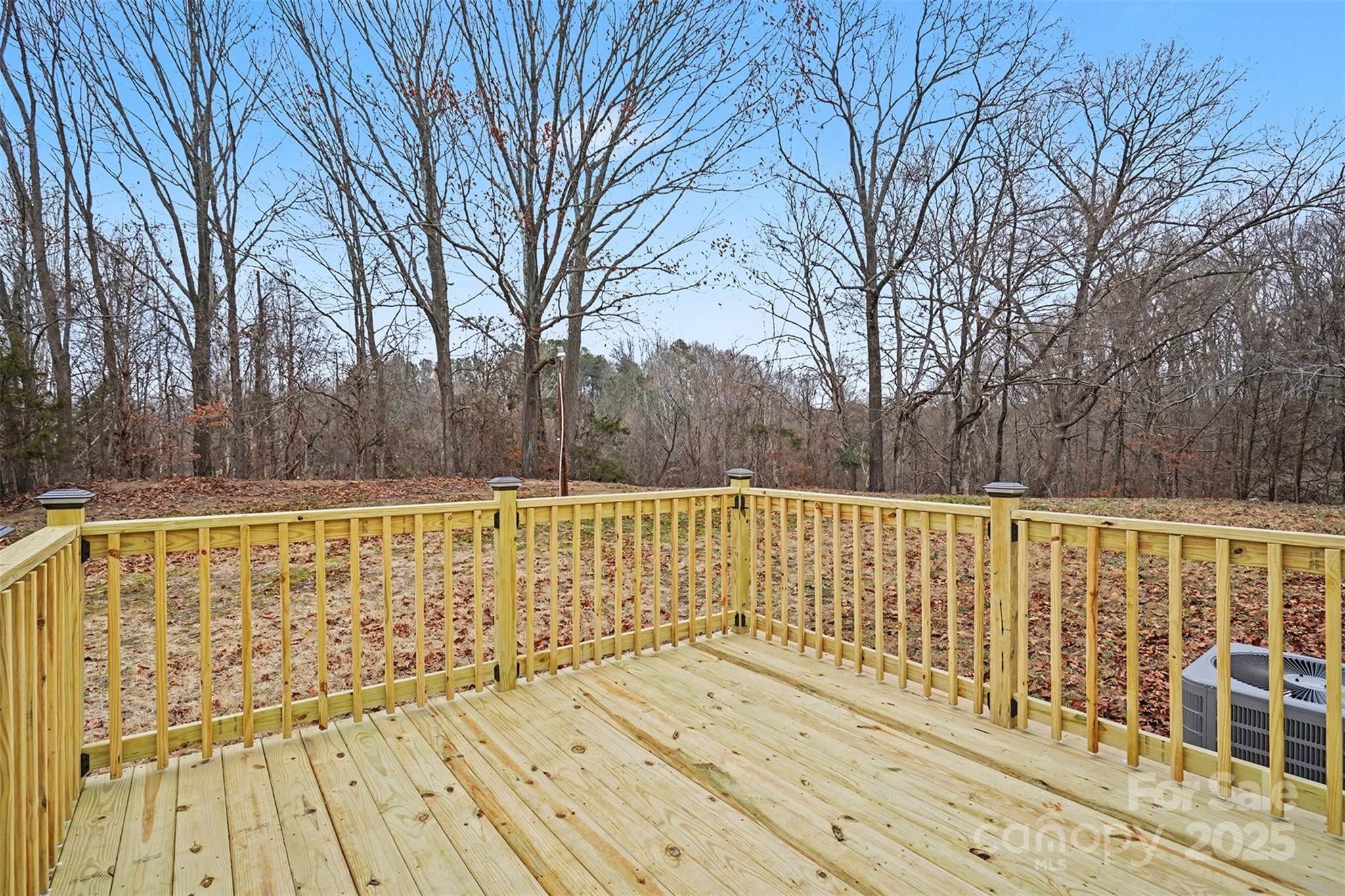 115 Lakeview Lane China Grove, NC 28023 - Photo 30 of 32 a view of wooden balcony with large trees