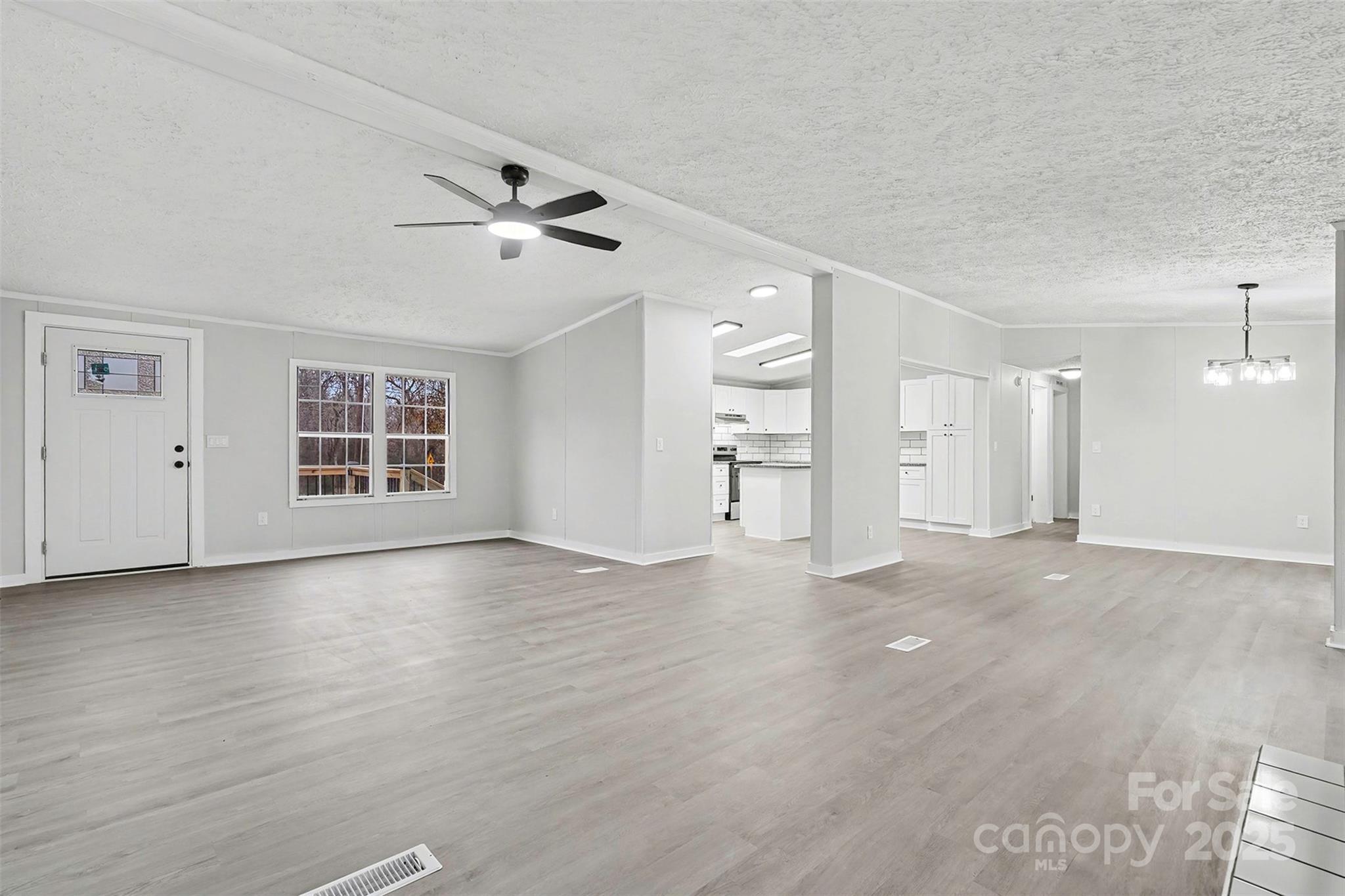 115 Lakeview Lane China Grove, NC 28023 - Photo 7 of 32 wooden floor in an empty room with a window