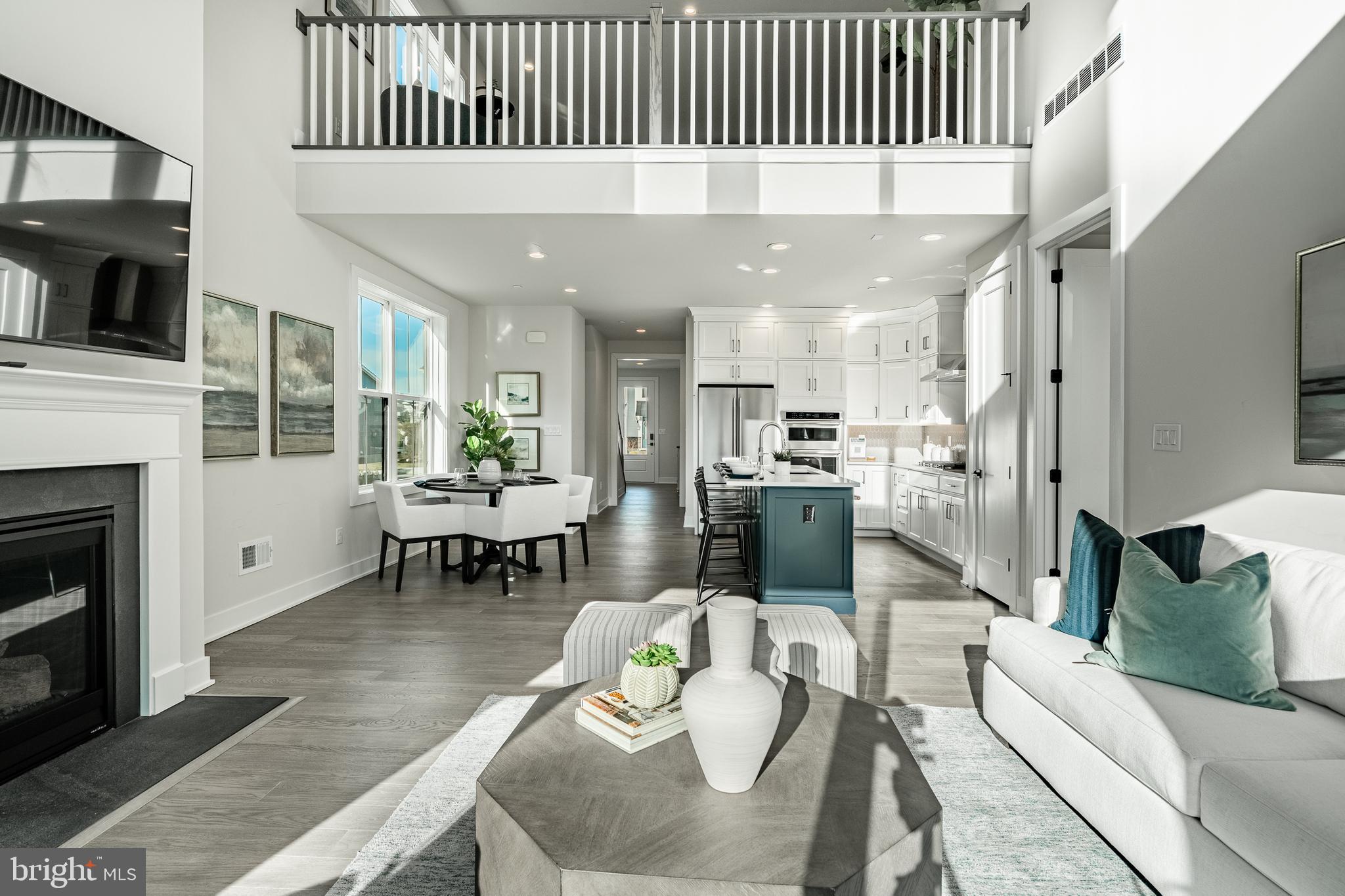 581 Trifecta Road Downingtown, PA 19335 - Photo 11 of 45 a living room with furniture a fireplace and a flat screen tv