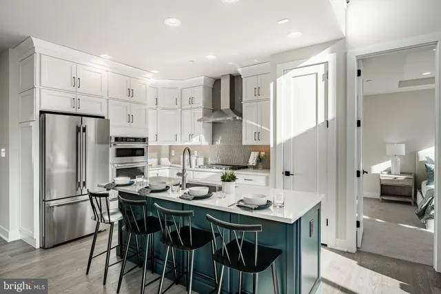 a kitchen with cabinets and appliances