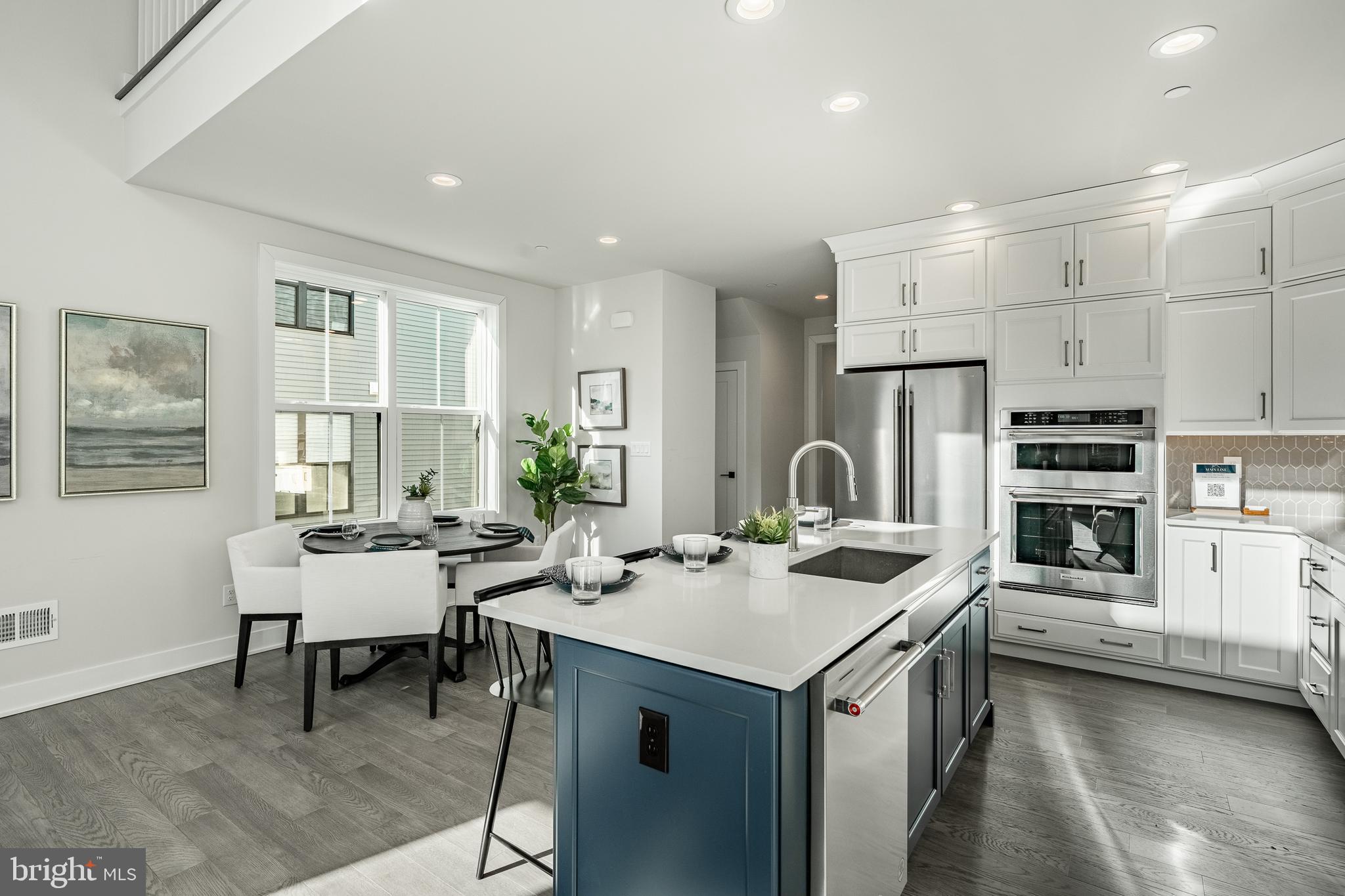 581 Trifecta Road Downingtown, PA 19335 - Photo 16 of 45 a room with stainless steel appliances kitchen island granite countertop a sink and cabinets