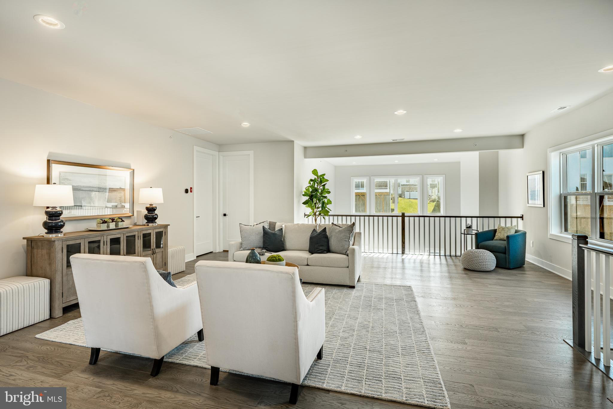 581 Trifecta Road Downingtown, PA 19335 - Photo 30 of 45 a living room with furniture floor to ceiling window and a table