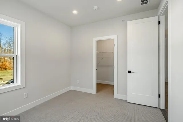 an empty room with entrance and door