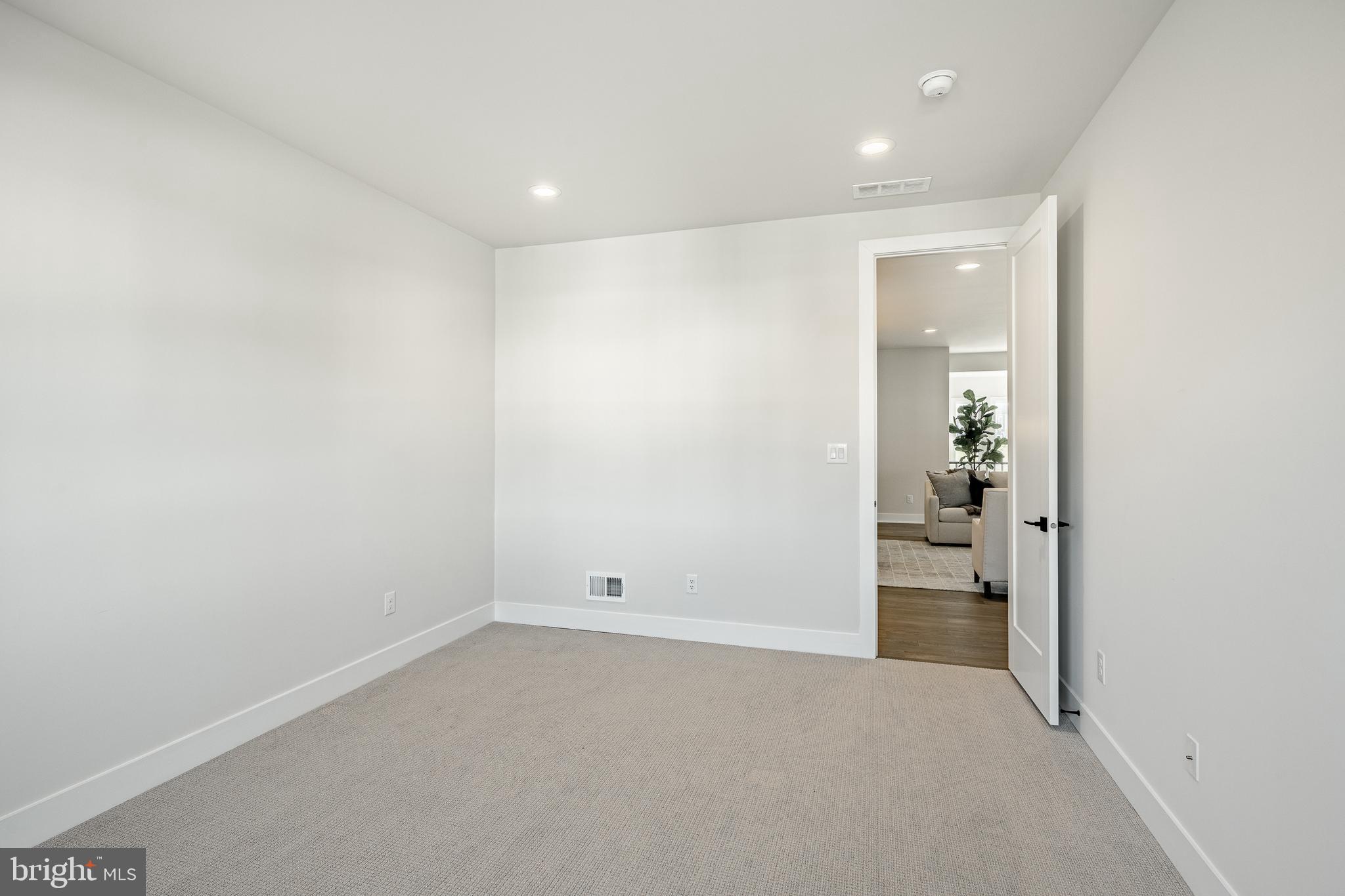 581 Trifecta Road Downingtown, PA 19335 - Photo 35 of 45 an empty room with entrance and door