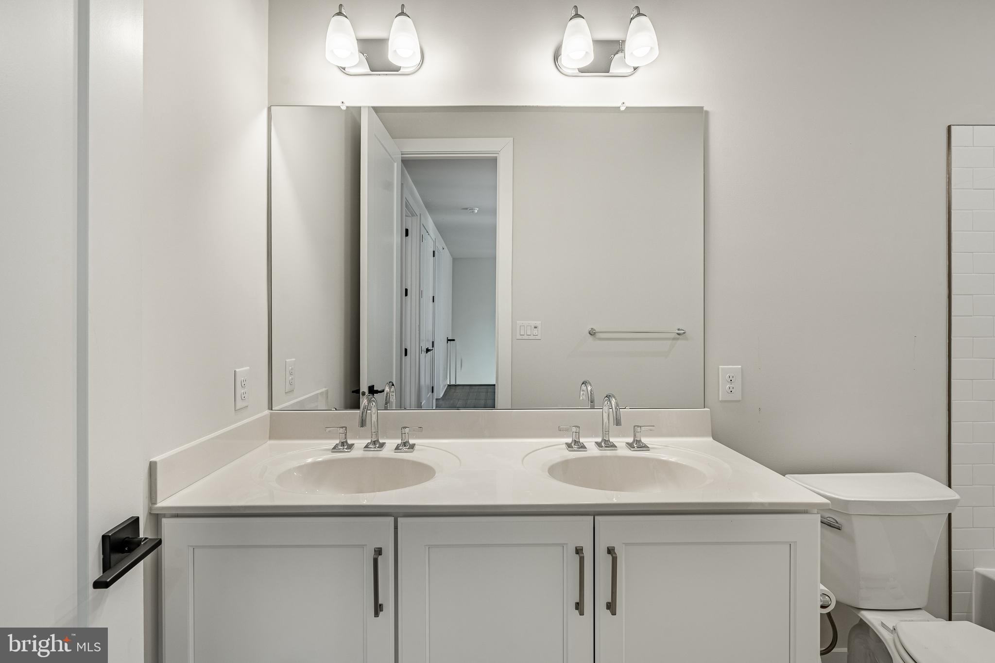 581 Trifecta Road Downingtown, PA 19335 - Photo 37 of 45 a bathroom with a sink and a mirror