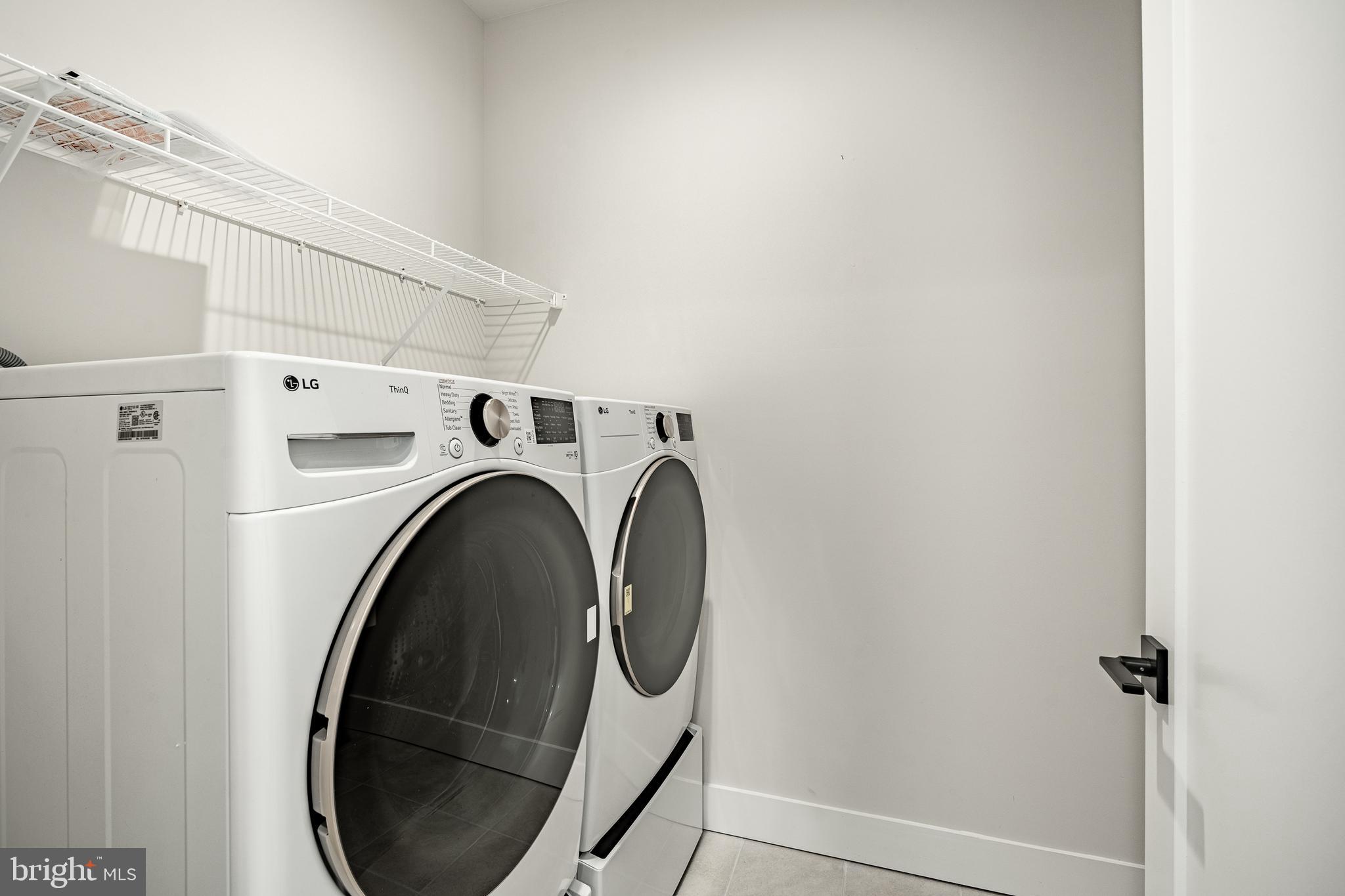 581 Trifecta Road Downingtown, PA 19335 - Photo 5 of 45 a utility room with dryer and washer