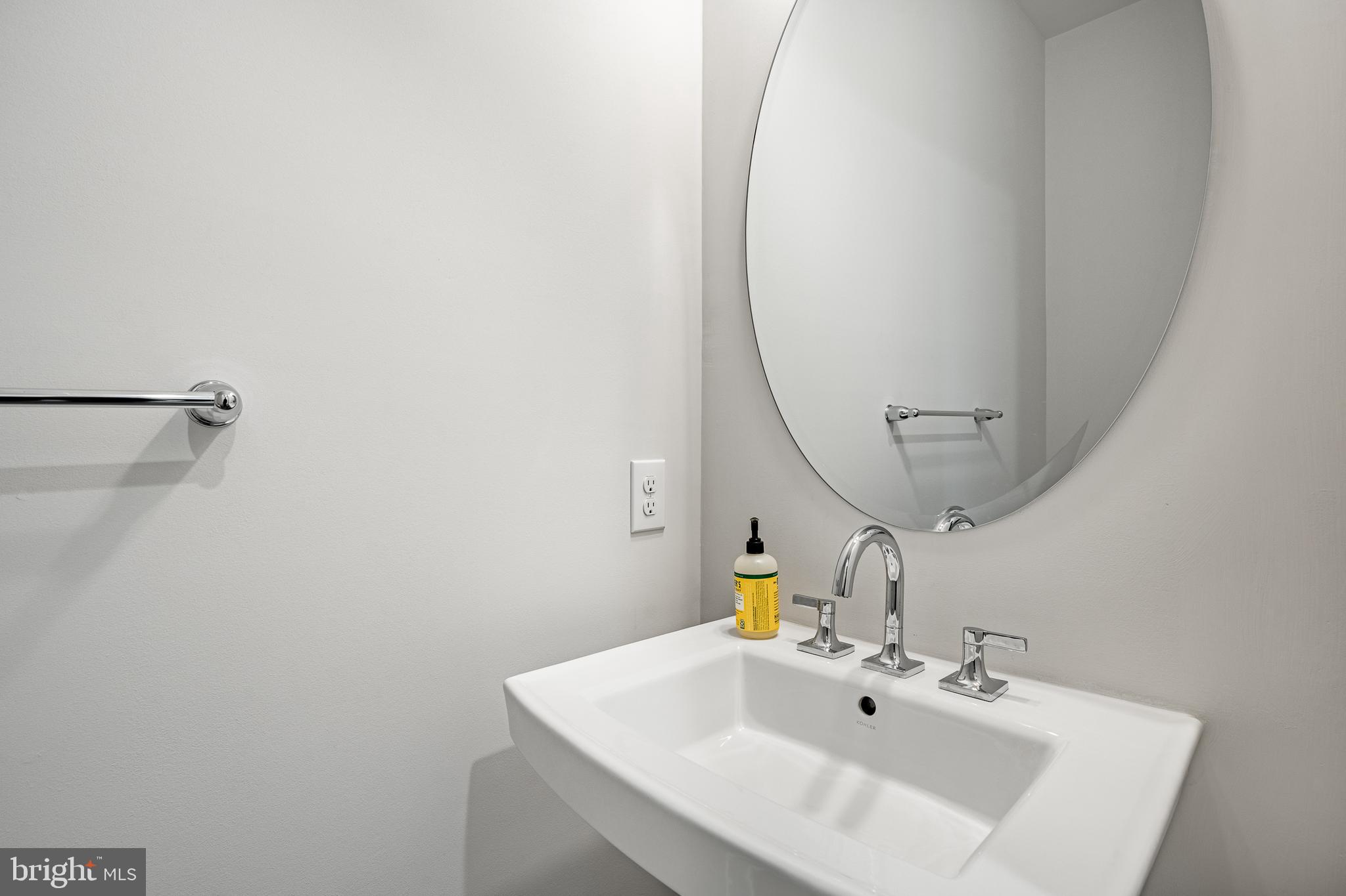 581 Trifecta Road Downingtown, PA 19335 - Photo 6 of 45 a bathroom with a sink and a mirror