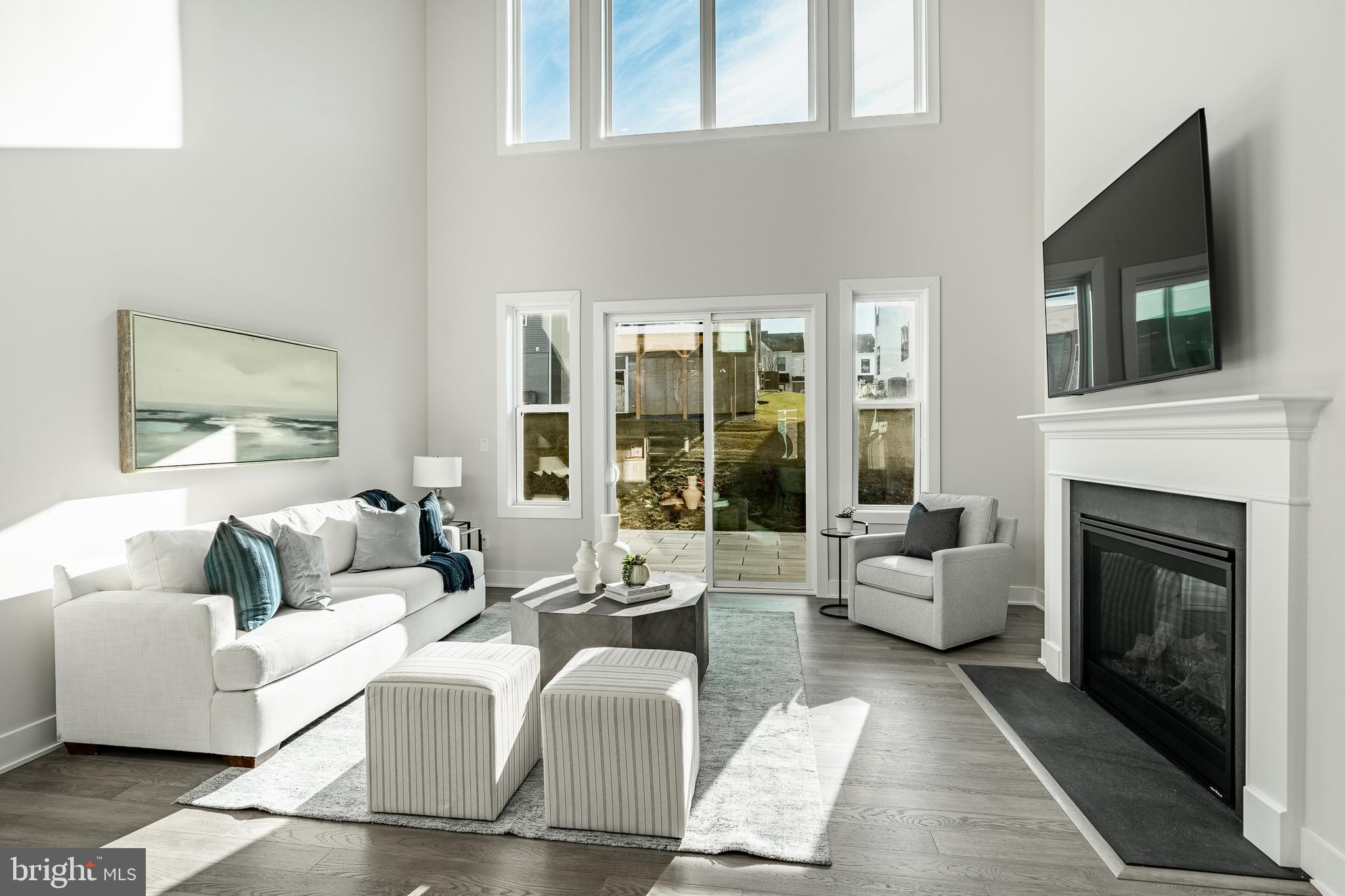 581 Trifecta Road Downingtown, PA 19335 - Photo 9 of 45 a living room with furniture and a fireplace