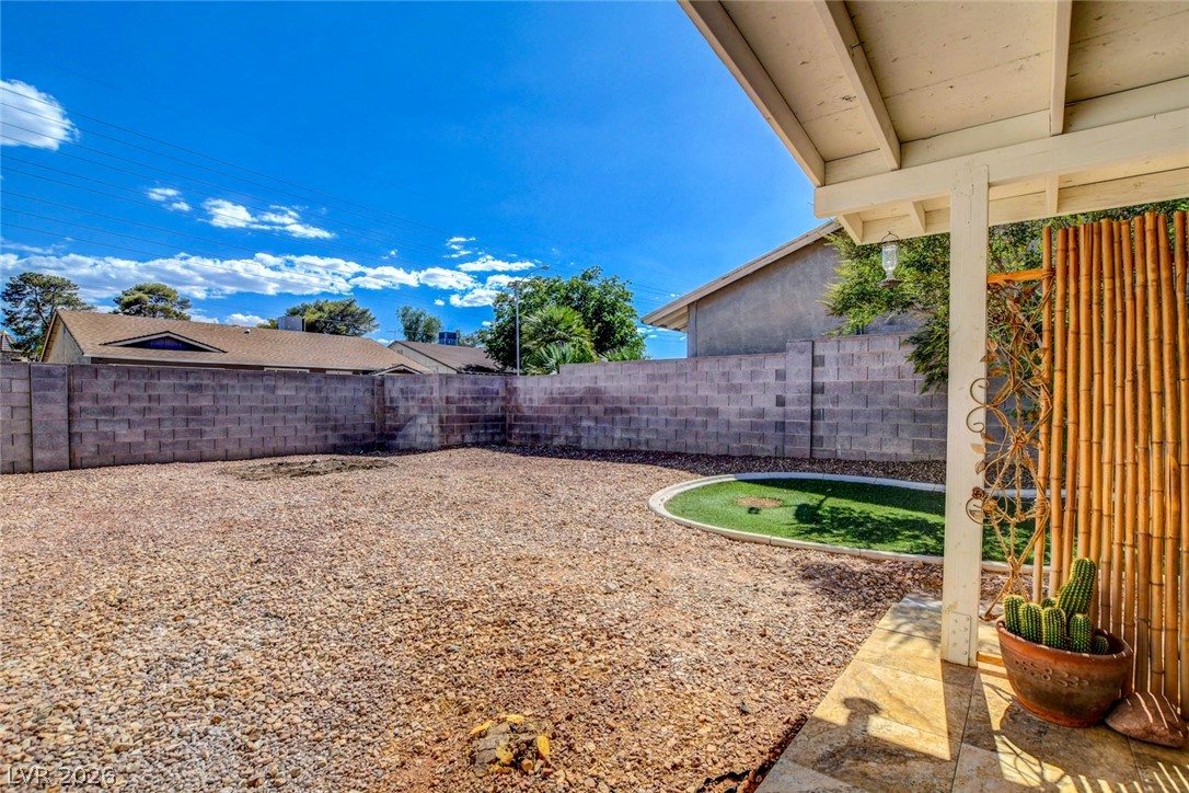 4367 South Mojave Road Las Vegas, NV 89121 - Photo 47 of 53 A spacious backyard awaits, complete with a block privacy fence and a small patch of green.