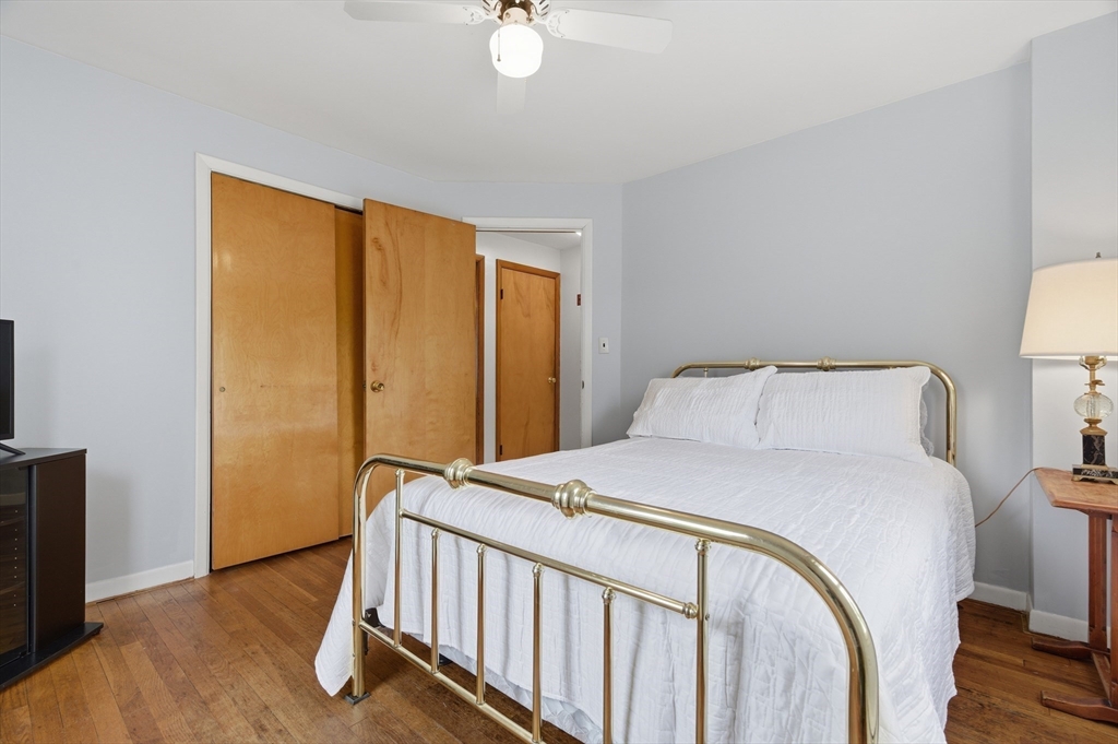 188 Glendale Road Attleboro, MA 02703 - Photo 12 of 37 a bedroom with a bed and wooden floor