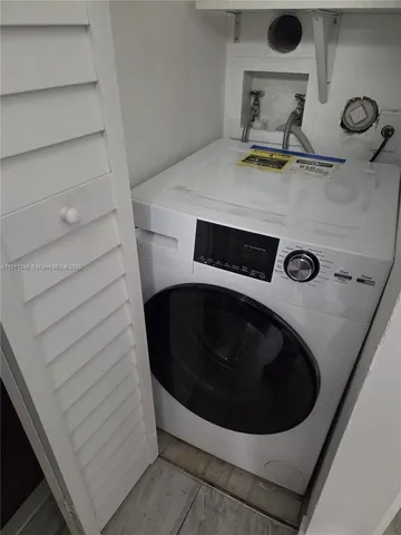 a bathroom with a bathtub and toilet