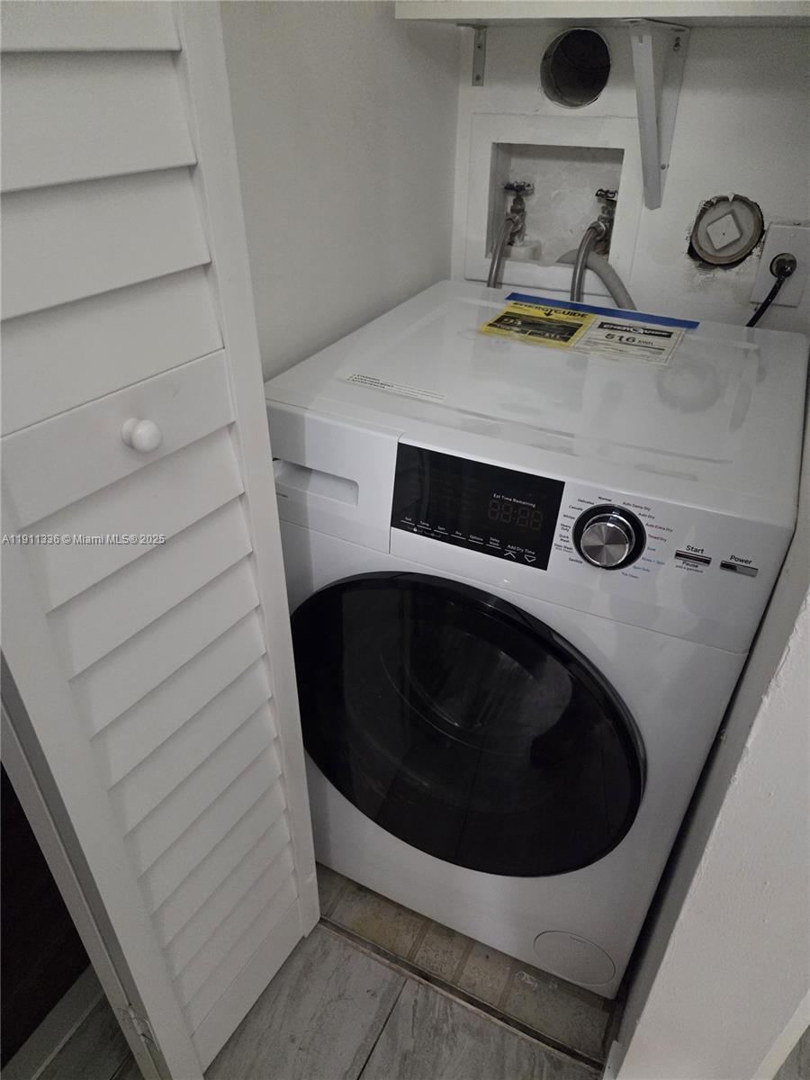 116 Northwest 60th Avenue, Unit 11 Margate, FL 33063 - Photo 17 of 18 a bathroom with a bathtub and toilet