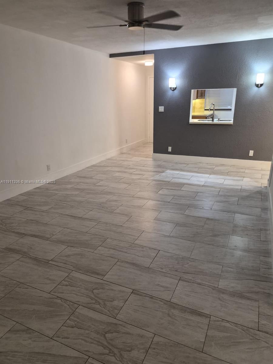 116 Northwest 60th Avenue, Unit 11 Margate, FL 33063 - Photo 2 of 18 a view of a livingroom with a bathroom