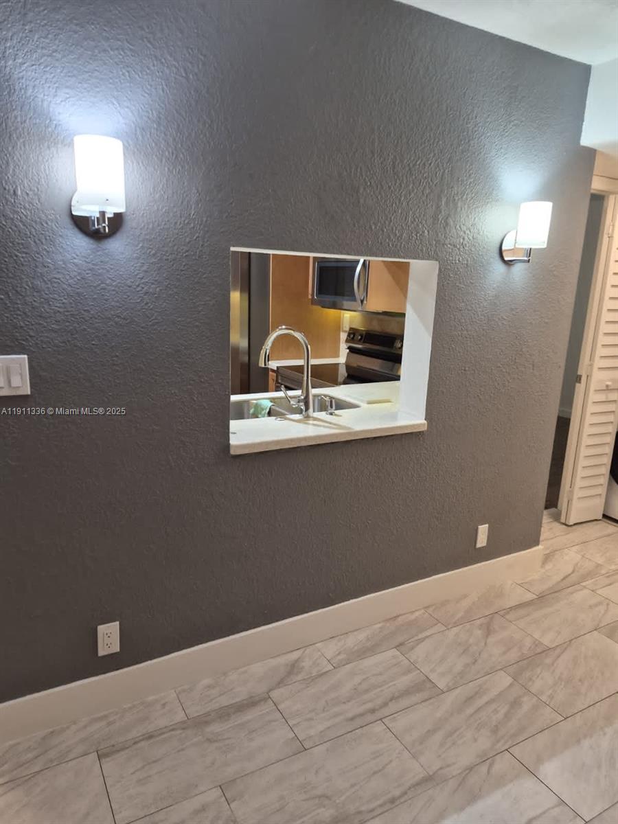 116 Northwest 60th Avenue, Unit 11 Margate, FL 33063 - Photo 3 of 18 a view of room with window